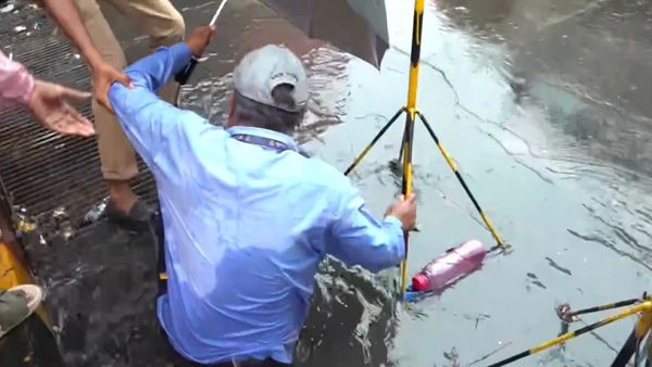 Worker Falls Into Manhole Right in Front of Mayor