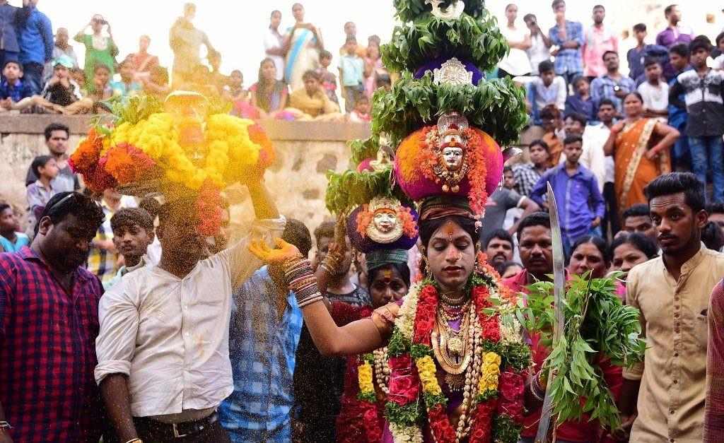 Devotees Continue Bonam Procession Amid Rain Near Golconda